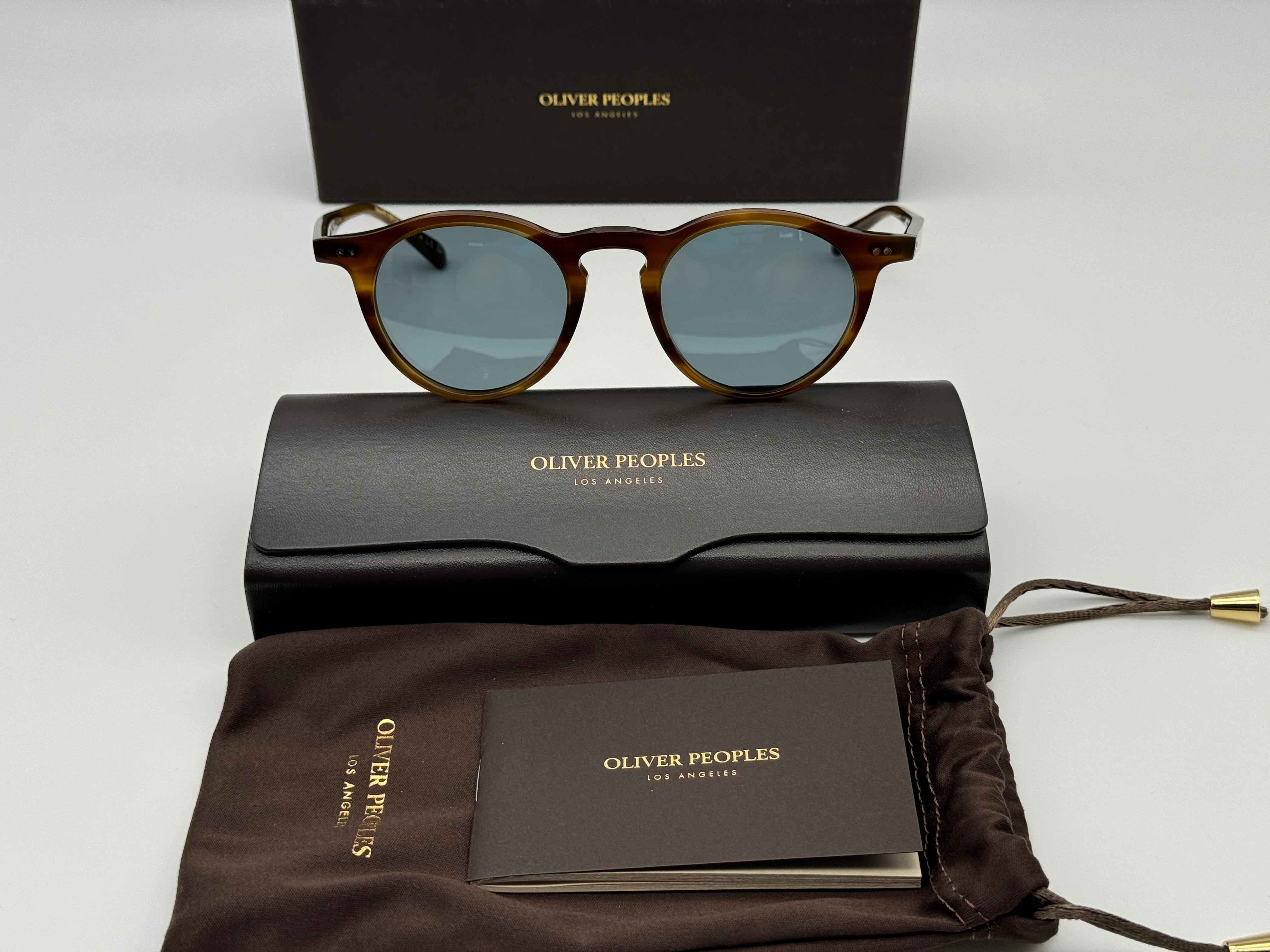 Made in Japan, OP-13 Sun is distinguishable by its wide endpieces and round  lens shape. A revival style from 1994, this classic frame glistens in  Gravel acetate.